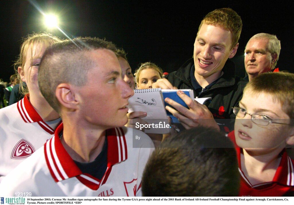 10 September 2003; Cormac Mc Anallen signs autographs for fans during the Tyrone GAA press night ahead of the 2003 Bank of Ireland All-Ireland Football Championship Final against Armagh. Carrickmore, Co. Tyrone. Picture credit; SPORTSFILE *EDI*