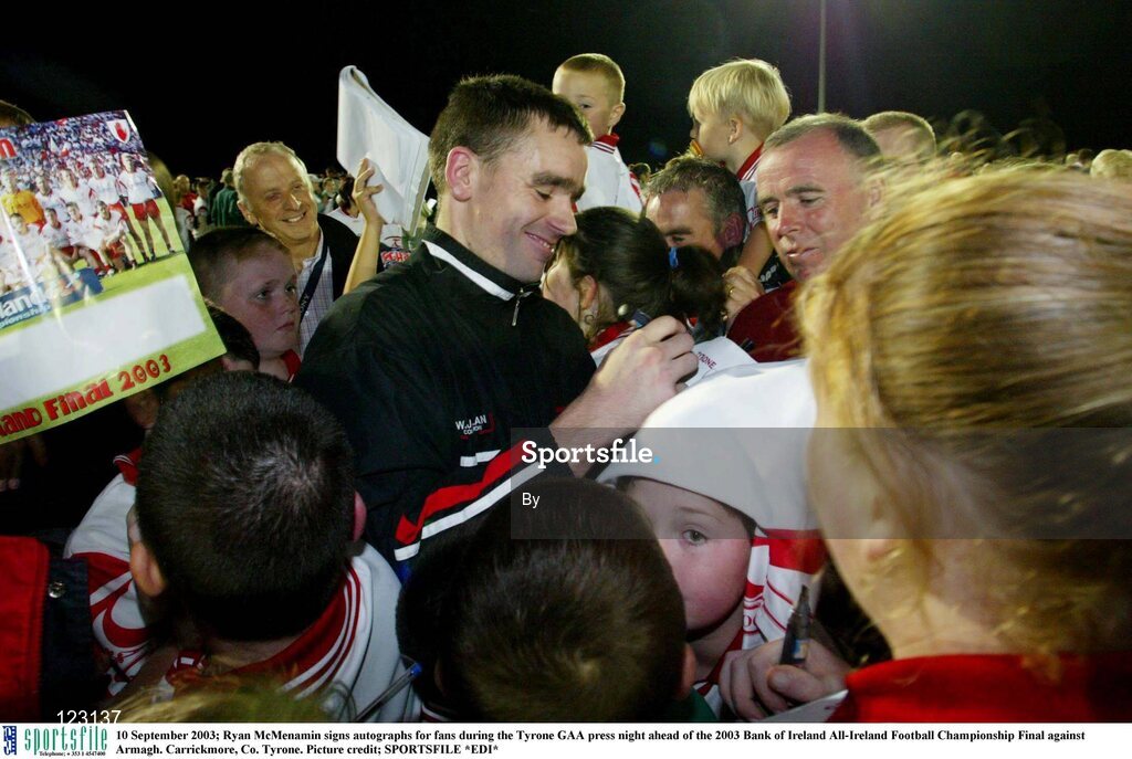 10 September 2003; Ryan McMenamin signs autographs for fans during the Tyrone GAA press night ahead of the 2003 Bank of Ireland All-Ireland Football Championship Final against Armagh. Carrickmore, Co. Tyrone. Picture credit; SPORTSFILE *EDI*
