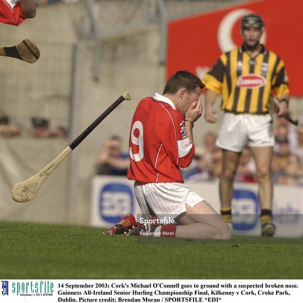 14 September 2003; Cork's Michael O'Connell goes to ground with a suspected broken nose. Guinness All-Ireland Senior Hurling Championship Final, Kilkenny v Cork, Croke Park, Dublin. Picture credit; Brendan Moran / SPORTSFILE *EDI*