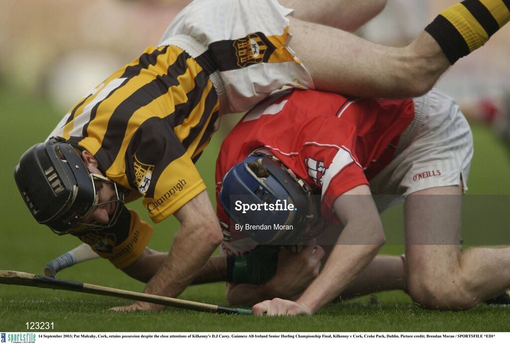 14 September 2003; Pat Mulcahy, Cork, retains possession despite the close attentions of Kilkenny's D.J Carey. Guinness All-Ireland Senior Hurling Championship Final, Kilkenny v Cork, Croke Park, Dublin. Picture credit; Brendan Moran / SPORTSFILE *EDI*