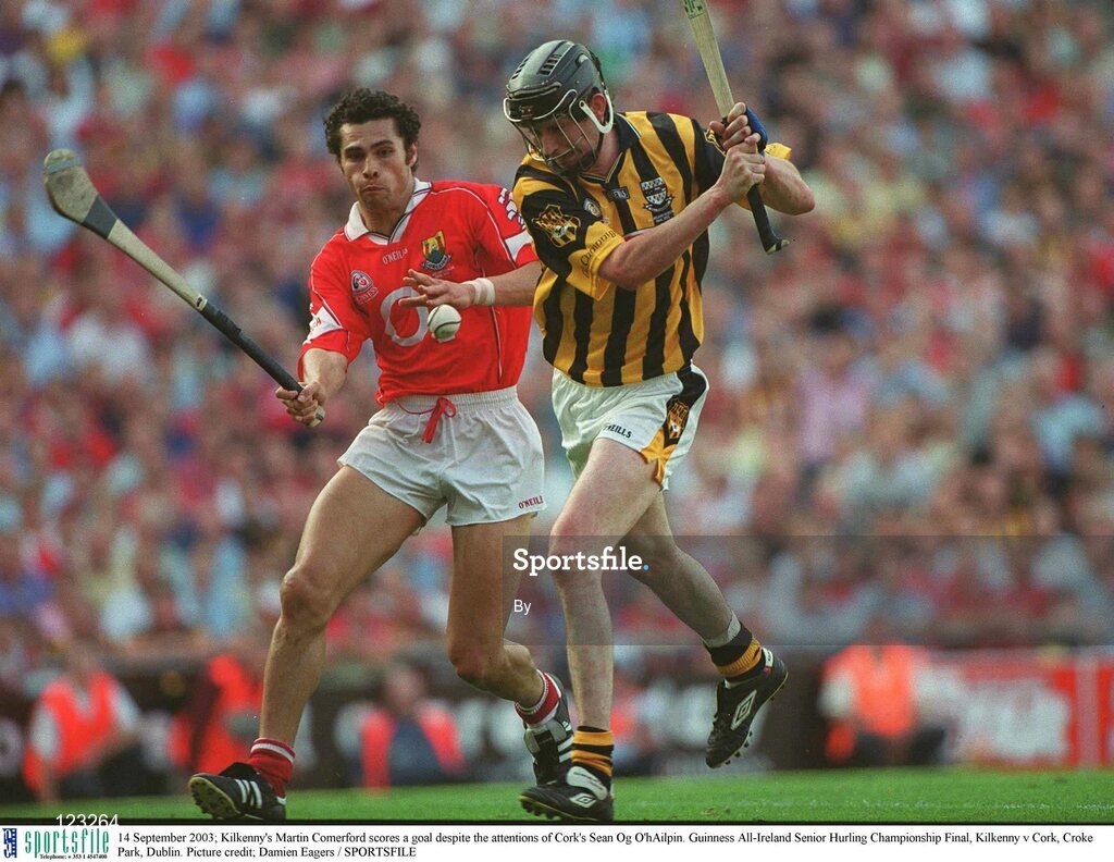 14 September 2003; Kilkenny's Martin Comerford scores a goal despite the attentions of Cork's Sean Og O'hAilpin. Guinness All-Ireland Senior Hurling Championship Final, Kilkenny v Cork, Croke Park, Dublin. Picture credit; Damien Eagers / SPORTSFILE