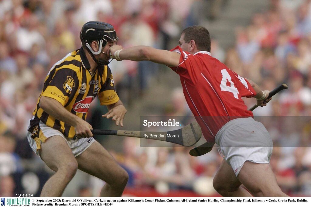 14 September 2003; Diarmuid O'Sullivan, Cork, in action against Kilkenny's Conor Phelan. Guinness All-Ireland Senior Hurling Championship Final, Kilkenny v Cork, Croke Park, Dublin. Picture credit;  Brendan Moran / SPORTSFILE *EDI*