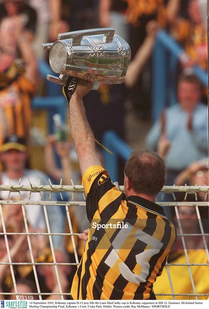 14 September 2003; Kilkenny captain D.J Carey lifts the Liam MacCarthy cup to Kilkenny supporters in Hill 16. Guinness All-Ireland Senior Hurling Championship Final, Kilkenny v Cork, Croke Park, Dublin. Picture credit; Ray McManus / SPORTSFILE