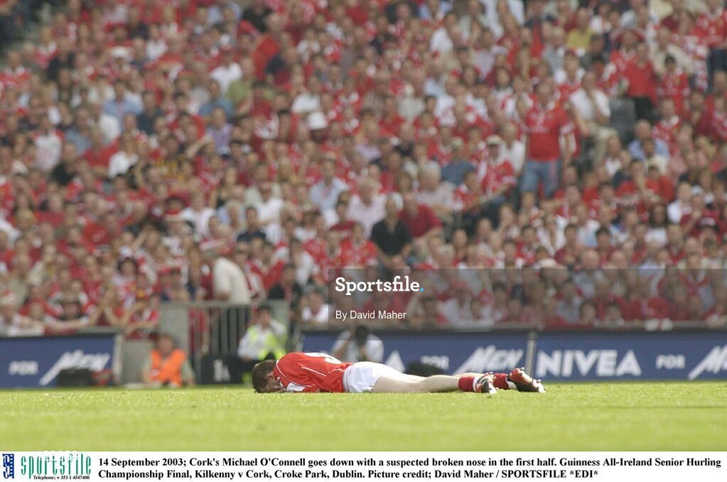 14 September 2003; Cork's Michael O'Connell goes down with a suspected broken nose in the first half. Guinness All-Ireland Senior Hurling Championship Final, Kilkenny v Cork, Croke Park, Dublin. Picture credit; David Maher / SPORTSFILE *EDI*