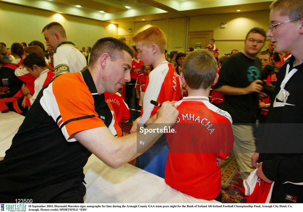 18 September 2003; Diarmaid Marsden signs autographs for fans during the Armagh County GAA team press night for the Bank of Ireland All-Ireland Football Championship Final, Armagh City Hotel, Co. Armagh. Picture credit; SPORTSFILE *EDI*