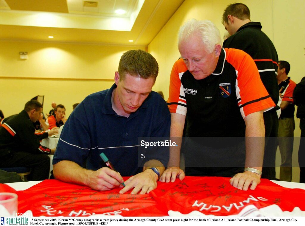 18 September 2003; Kieran McGeeney autographs a team jersey during the Armagh County GAA team press night for the Bank of Ireland All-Ireland Football Championship Final, Armagh City Hotel, Co. Armagh. Picture credit; SPORTSFILE *EDI*