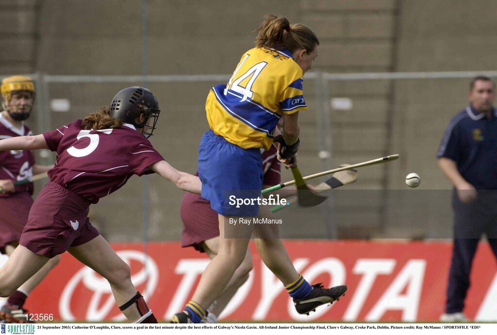 21 September 2003; Catherine O'Loughlin, Clare, scores a goal in the last minute despite the best efforts of Galway's Nicola Gavin. All-Ireland Junior Championship Final, Clare v Galway, Croke Park, Dublin. Picture credit; Ray McManus / SPORTSFILE *EDI*