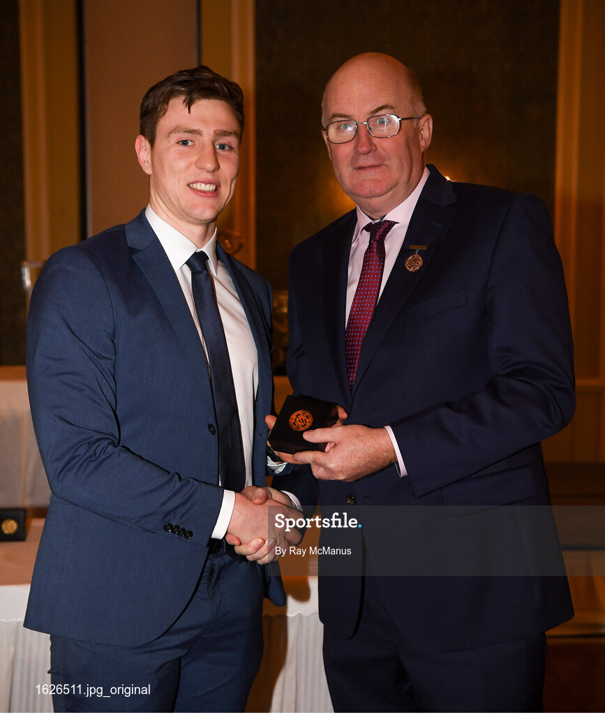 22 December 2018; James Small of Dublin is presented with his GAA Football All-Ireland Senior Championship medal by Uachtarán Chumann Lúthchleas Gael John Horan at the InterContinental Dublin, Simmonscourt Road, Ballsbridge, Dublin Photo by Ray McManus/Sportsfile
