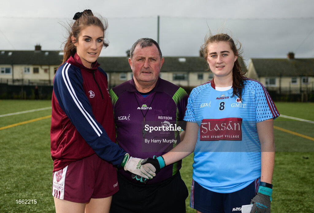 8 March 2019; Eilish O'Dowd of Marino and Amy Wharton of NUIG shake hands across referee Derek McKitterick prior to the Gourmet Food Parlour Donaghy Cup Final match between Galway Mayo Institute of Technology and Marino at TU Dublin Broombridge Sports Grounds in Dublin. Photo by Harry Murphy/Sportsfile