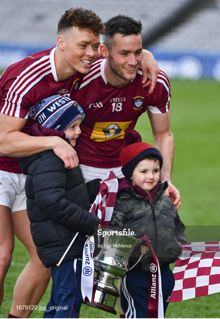 6 April 2019; Tommy McDaniel, left, and Noel Mulligan of Westmeath with five year old Tom and three year old Conor Adamson, from Moat, celebrate after the Allianz Football League Division 3 Final match between Laois and Westmeath at Croke Park in Dublin. Photo by Ray McManus/Sportsfile