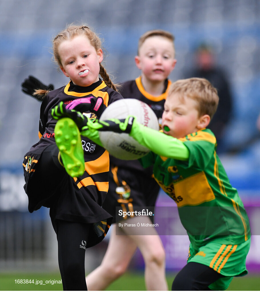 14 April 2019; Emma Condra of Nobber, Co Meath, in action against Donie Connaughton of Tubberclair, Co Westmeath, during the Littlewoods Ireland Go Games Provincial Days in Croke Park. This year over 6,000 boys and girls aged between six and twelve represented their clubs in a series of mini blitzes and just like their heroes got to play in Croke Park. Photo by Piaras Ó Mídheach/Sportsfile