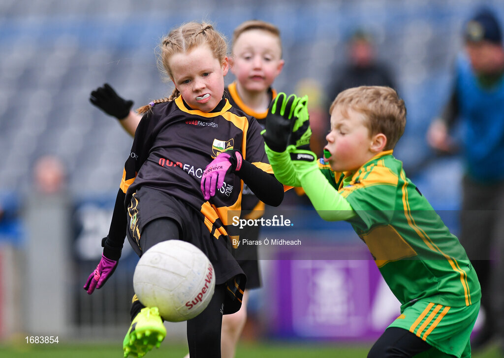 14 April 2019; Emma Condra of Nobber, Co Meath, in action against Donie Connaughton of Tubberclair, Co Westmeath, during the Littlewoods Ireland Go Games Provincial Days in Croke Park. This year over 6,000 boys and girls aged between six and twelve represented their clubs in a series of mini blitzes and just like their heroes got to play in Croke Park. Photo by Piaras Ó Mídheach/Sportsfile