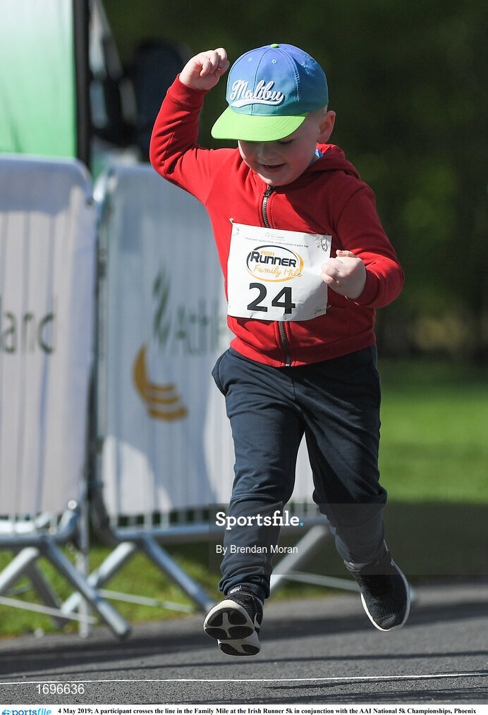 4 May 2019; A participant crosses the line in the Family Mile at the Irish Runner 5k in conjunction with the AAI National 5k Championships, Phoenix Park in Dublin. Photo by Brendan Moran/Sportsfile
