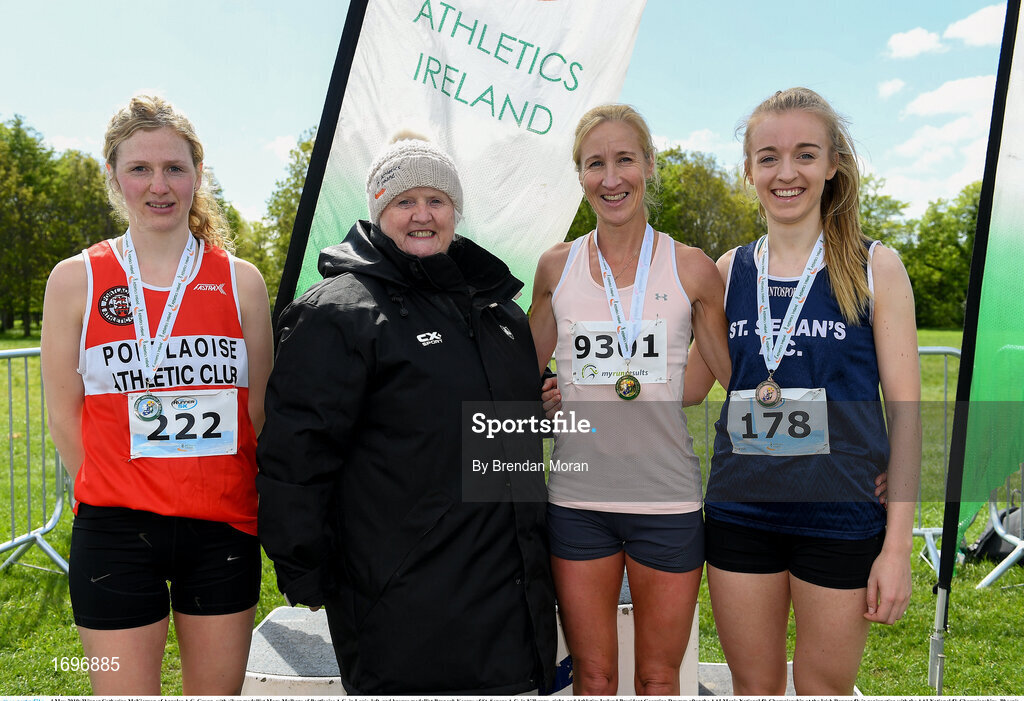 4 May 2019; Winner Catherina McKiernan of Annalee A.C, Cavan, with silver medallist Mary Mulhare of Portlaoise A.C. in Laois, left, and bronze medallist Bronagh Kearns of St. Senans A.C. in Kilkenny, right, and Athletics Ireland President Georgina Drumm after the AAI Men's National 5k Championship at the Irish Runner 5k in conjunction with the AAI National 5k Championships, Phoenix Park in Dublin. Photo by Brendan Moran/Sportsfile