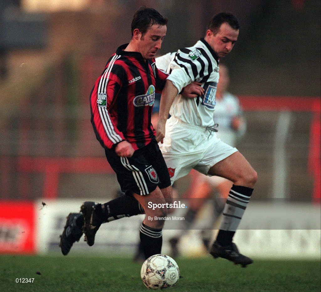 14 December 1997; Derek McGrath of Bohemians in action against Raymond McCoy of Dundalk during the Harp Lager National League Premier Division match between Bohemians and Dundalk at Dalymount Park in Dublin. Photo by Brendan Moran/Sportsfile