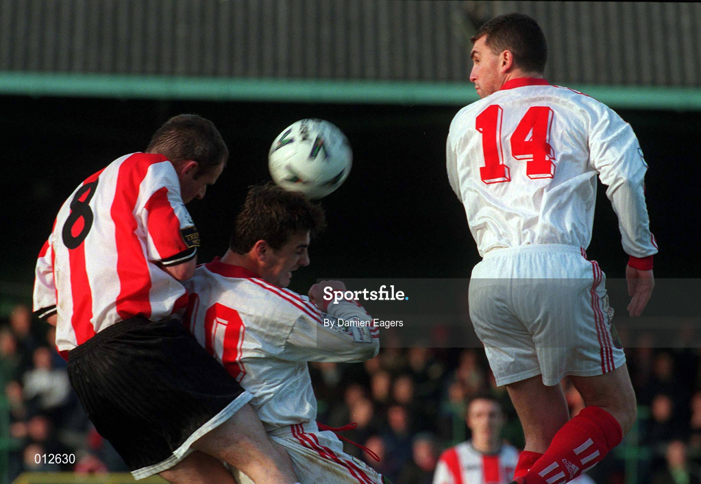 29 November 1998; Paul Hegarty of Derry City in action against Mark Herrick and Pat Morley of Cork City during the Harp Lager National League Premier Division match between Derry City and Cork City at the Brandywell Stadium in Derry. Photo by Damien Eagers/Sportsfile