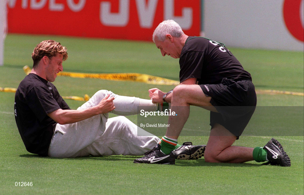 21 June 1994; Andy Townsend is treated by team physiotherapist Mick Byrne during a Republic of Ireland training session during the FIFA World Cup 1994 in New Jersey, USA. Photo by David Maher/Sportsfile