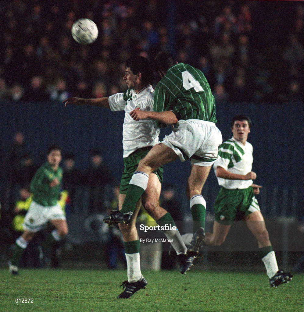 17 November 1993; Niall Quinn of Republic of Ireland in action against Gerry Taggart of  Northern Ireland during the FIFA World Cup Qualifier match between Northern Ireland and Republic of Ireland at Windsor Park in Belfast. Photo by Ray McManus/Sportsfile