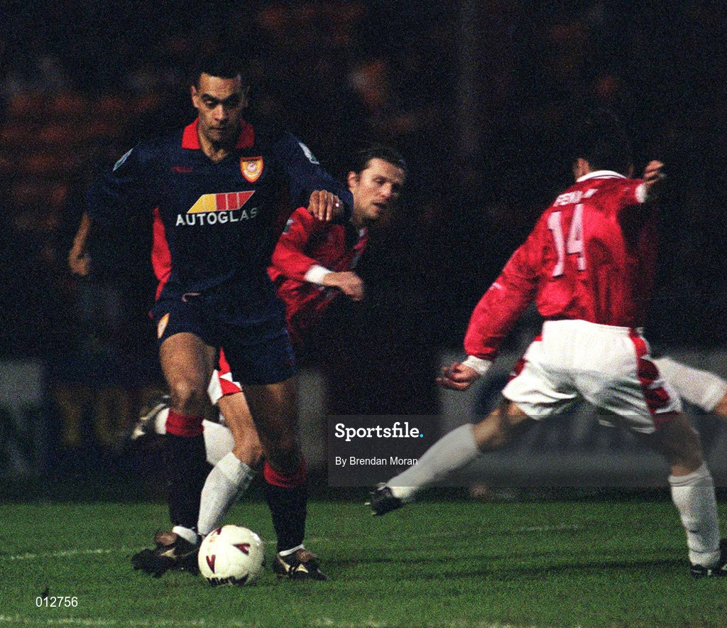 12 December 1997; Paul Osam of St. Patrick's Athletic in action against Dessie Baker and Pat Fenlon of Shelbourne during the Harp Lager National League Premier Division match between Shelbourne and St Patrick's Athletic at Tolka Park in Dublin. Photo by Brendan Moran/Sportsfile