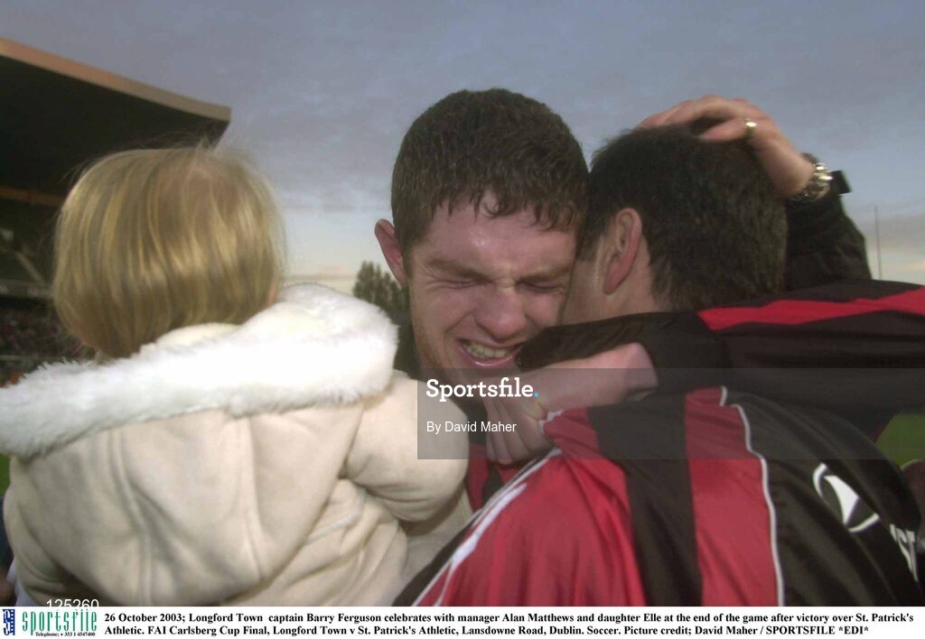 26 October 2003; Longford Town  captain Barry Ferguson celebrates with manager Alan Mathews and daughter Elle at the end of the game after victory over St. Patrick's Athletic. FAI Carlsberg Cup Final, Longford Town v St. Patrick's Athletic, Lansdowne Road, Dublin. Soccer. Picture credit; David Maher / SPORTSFILE *EDI*