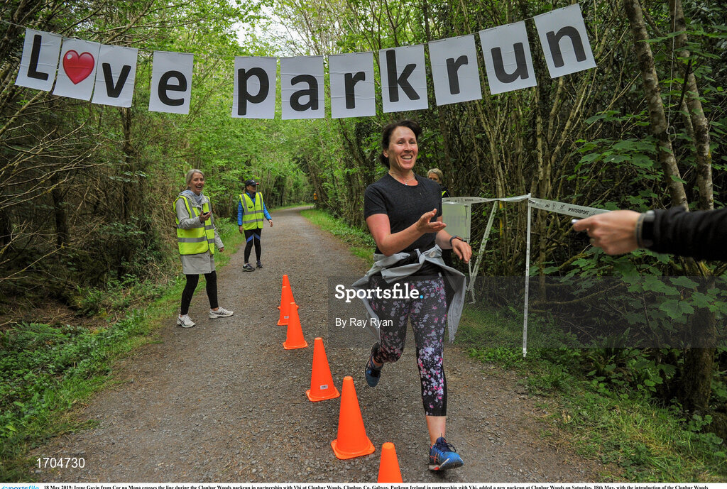 18 May 2019; Irene Gavin from Cor na Mona crosses the line during the Clonbur Woods parkrun in partnership with Vhi at Clonbur Woods, Clonbur, Co. Galway. Parkrun Ireland in partnership with Vhi, added a new parkrun at Clonbur Woods on Saturday, 18th May, with the introduction of the Clonbur Woods parkrun in Clonbur, Co. Galway. Parkruns take place over a 5km course weekly, are free to enter and are open to all ages and abilities, providing a fun and safe environment to enjoy exercise. To register for a parkrun near you visit www.parkrun.ie. Photo by Ray Ryan/Sportsfile