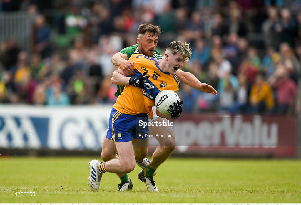 22 June 2019; Gavin Cooney of Clare in action against Conor Reynolds of Leitrim during the GAA Football All-Ireland Senior Championship Round 2 match between Leitrim and Clare at Avantcard Páirc Seán Mac Diarmada in Carrick-on-Shannon, Leitrim. Photo by Daire Brennan/Sportsfile