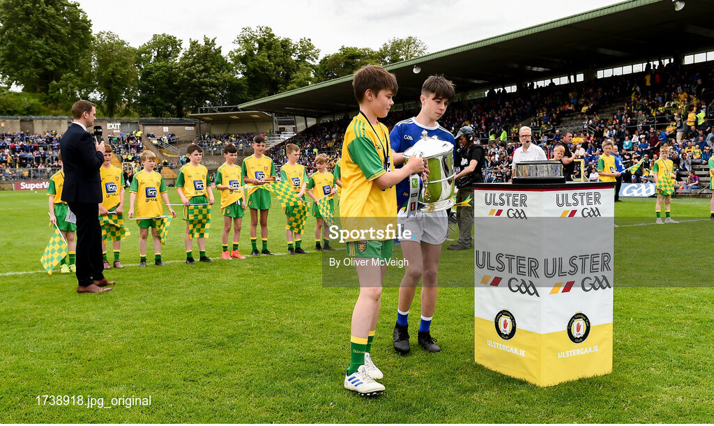 23 June 2019; Matthew Whitmore of Donegal and Darragh Noonan of Cavanbring out the Anglo Celt cup before the Ulster GAA Football Senior Championship Final match between Donegal and Cavan at St Tiernach's Park in Clones, Monaghan. Photo by Oliver McVeigh/Sportsfile