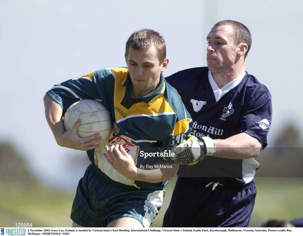 2 November 2003; Gary Cox of Ireland is tackled by Karl Dowling of Victoria State during theInternational Challange match between Victoria State and Ireland at Gaelic Park in Keysborough, Melbourne, Victoria, Australia. Photo by Ray McManus/Sportsfile