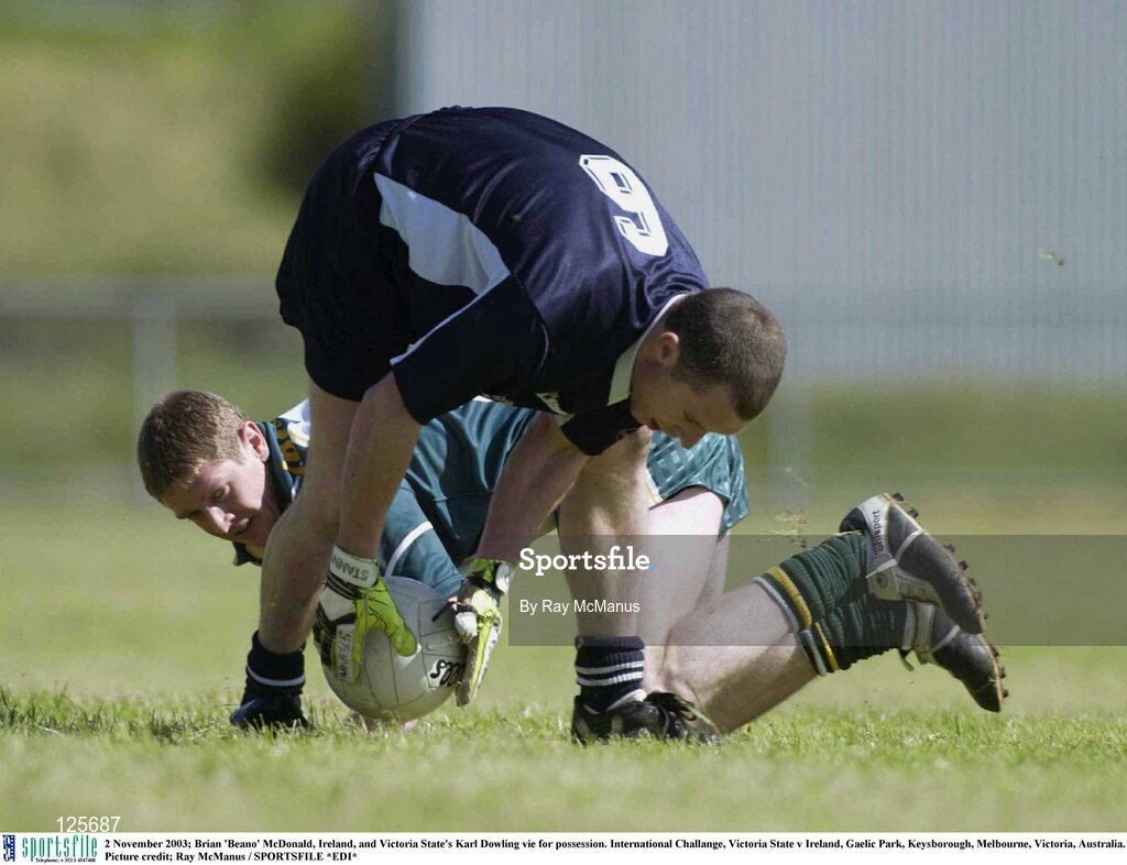2 November 2003; Brian 'Beano' McDonald, Ireland, and Victoria State's Karl Dowling vie for possession. International Challange, Victoria State v Ireland, Gaelic Park, Keysborough, Melbourne, Victoria, Australia. Picture credit; Ray McManus / SPORTSFILE *EDI*