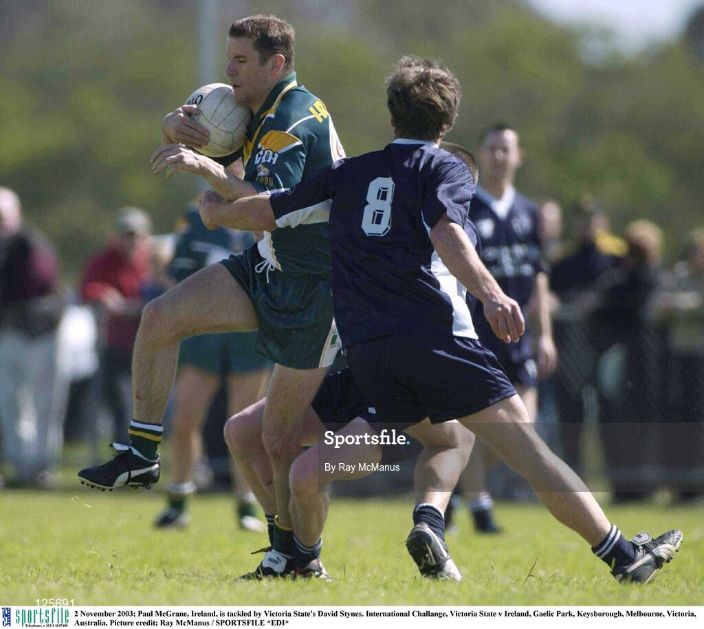 2 November 2003; Paul McGrane, Ireland, is tackled by Victoria State's David Stynes. International Challange, Victoria State v Ireland, Gaelic Park, Keysborough, Melbourne, Victoria, Australia. Picture credit; Ray McManus / SPORTSFILE *EDI*