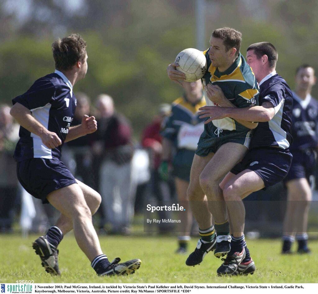 2 November 2003; Paul McGrane, Ireland, is tackled by Victoria State's Paul Kelleher and left, David Stynes. International Challange, Victoria State v Ireland, Gaelic Park, Keysborough, Melbourne, Victoria, Australia. Picture credit; Ray McManus / SPORTSFILE *EDI*