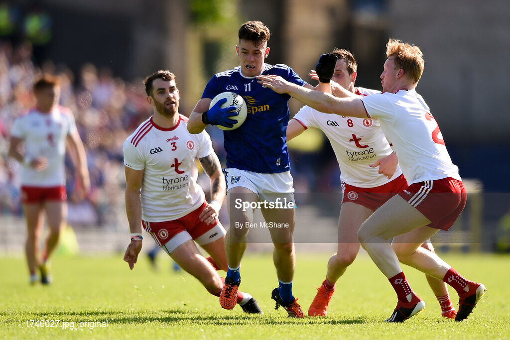 6 July 2019; Dara McVetty of Cavan in action against Tyrone players, from left, Ronan McNamee, Colm Cavanagh, and Hugh Pat McGeary during the GAA Football All-Ireland Senior Championship Round 4 match between Cavan and Tyrone at St. Tiernach's Park in Clones, Monaghan. Photo by Ben McShane/Sportsfile