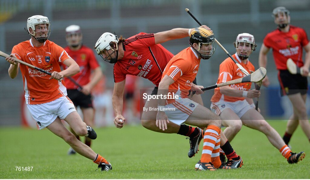 16 June 2013; Gareth Johnson, Down, in action against, from left, Padraig Hughes, Ciaran Clifford and Michael McCullogh, Armagh. Ulster GAA Hurling Senior Championship Quarter-Final, Down v Armagh, Páirc Esler, Newry, Co. Down. Picture credit: Brian Lawless / SPORTSFILE