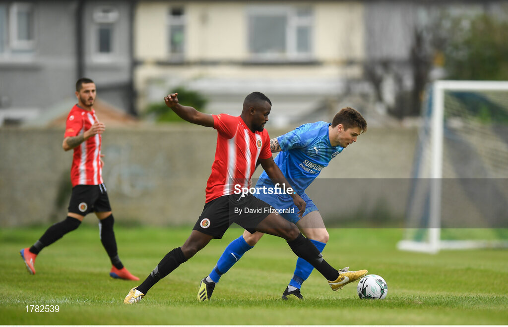 25 August 2019; Conor Murphy of Crumlin United in action against Tamena Dinamunenga of Lucan United during the Extra.ie FAI Cup Second Round match between Crumlin United and Lucan United at CBS Captain's Road in Crumlin, Dublin. Photo by David Fitzgerald/Sportsfile