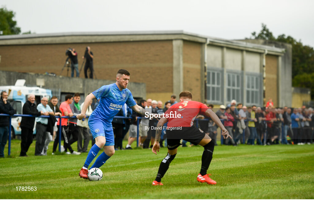 25 August 2019; Craig Walsh of Crumlin United in action against Shane Maloney of Lucan United during the Extra.ie FAI Cup Second Round match between Crumlin United and Lucan United at CBS Captain's Road in Crumlin, Dublin. Photo by David Fitzgerald/Sportsfile