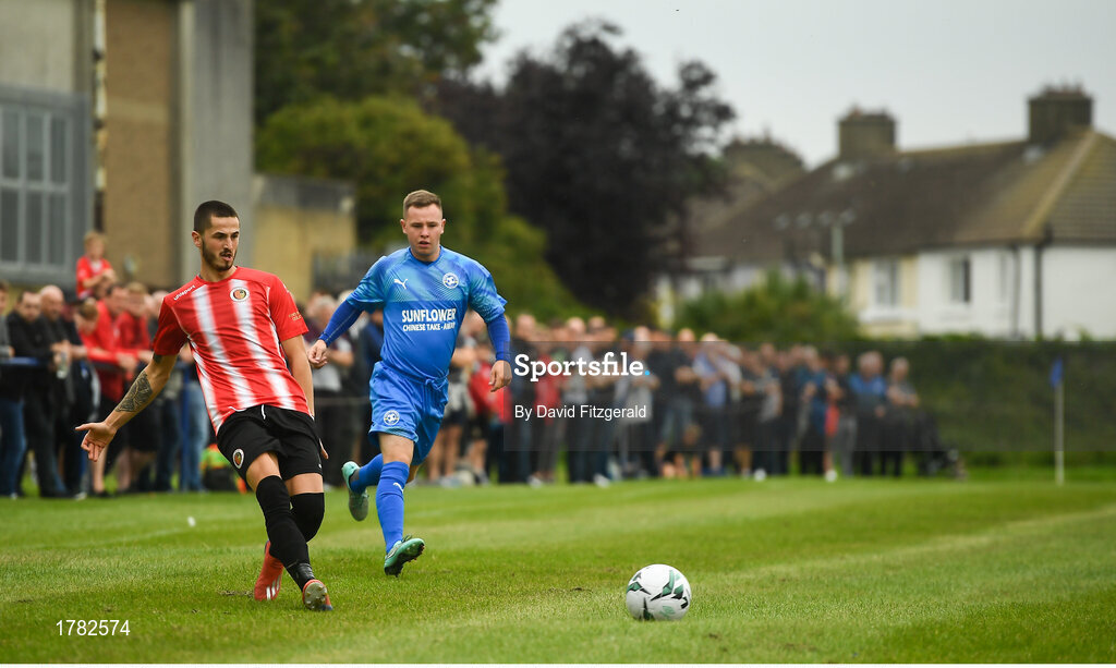 25 August 2019; Marco Chinden of Lucan United in action against Noel Cummins of Crumlin United during the Extra.ie FAI Cup Second Round match between Crumlin United and Lucan United at CBS Captain's Road in Crumlin, Dublin. Photo by David Fitzgerald/Sportsfile
