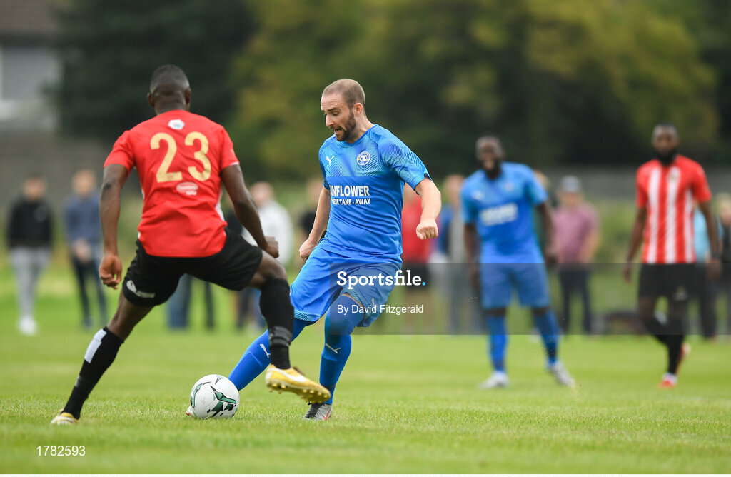 25 August 2019; Alan McGreal of Crumlin United in action against Tamena Dinamunenga of Lucan United during the Extra.ie FAI Cup Second Round match between Crumlin United and Lucan United at CBS Captain's Road in Crumlin, Dublin. Photo by David Fitzgerald/Sportsfile