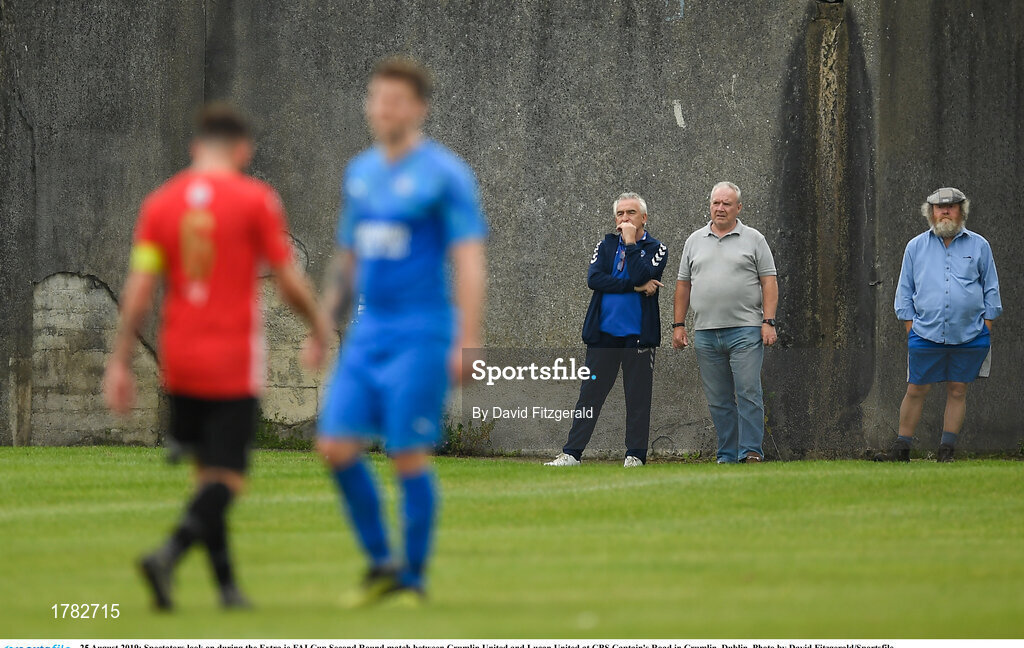 25 August 2019; Spectators look on during the Extra.ie FAI Cup Second Round match between Crumlin United and Lucan United at CBS Captain's Road in Crumlin, Dublin. Photo by David Fitzgerald/Sportsfile