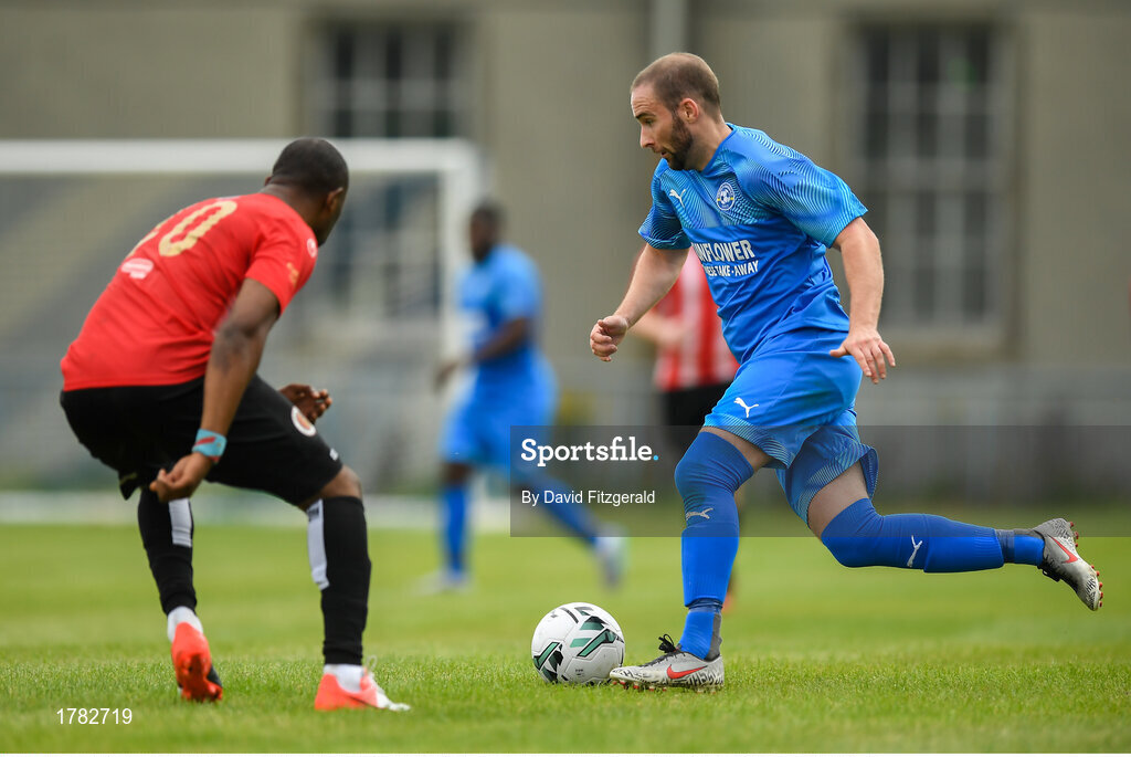 25 August 2019; Alan McGreal of Crumlin United in action against Boby Mazono of Lucan United during the Extra.ie FAI Cup Second Round match between Crumlin United and Lucan United at CBS Captain's Road in Crumlin, Dublin. Photo by David Fitzgerald/Sportsfile
