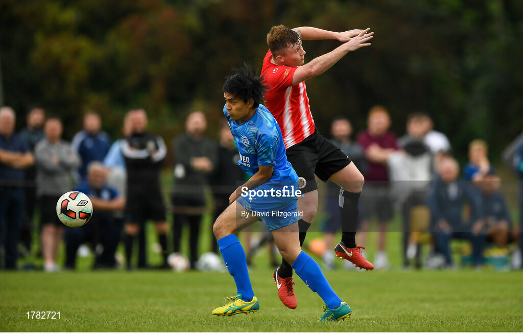 25 August 2019; Gingi Aki of Crumlin United in action against Sean Cronin of Lucan United during the Extra.ie FAI Cup Second Round match between Crumlin United and Lucan United at CBS Captain's Road in Crumlin, Dublin. Photo by David Fitzgerald/Sportsfile