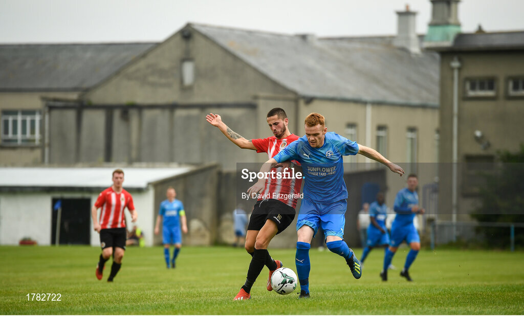 25 August 2019; Gareth Brady of Crumlin United in action against Marco Chinden of Lucan United during the Extra.ie FAI Cup Second Round match between Crumlin United and Lucan United at CBS Captain's Road in Crumlin, Dublin. Photo by David Fitzgerald/Sportsfile