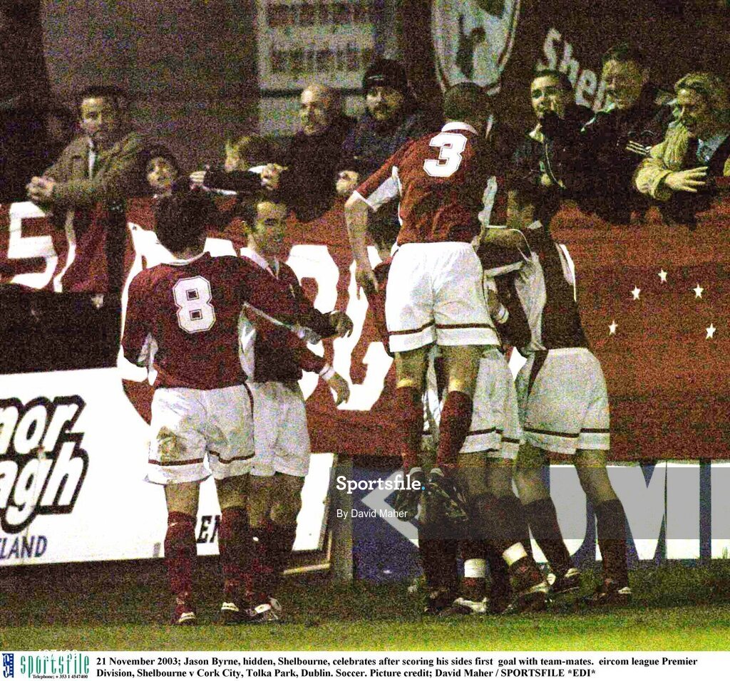 21 November 2003; Jason Byrne, hidden, Shelbourne, celebrates after scoring his sides first  goal with team-mates.  eircom league Premier Division, Shelbourne v Cork City, Tolka Park, Dublin. Soccer. Picture credit; David Maher / SPORTSFILE *EDI*