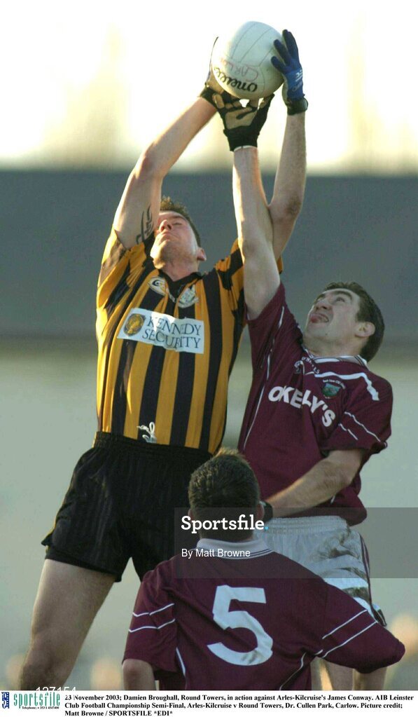 23 November 2003; Damien Broughall, Round Towers, in action against Arles-Kilcruise's James Conway. AIB Leinster Club Football Championship Semi-Final, Arles-Kilcruise v Round Towers, Dr. Cullen Park, Carlow. Picture credit; Matt Browne / SPORTSFILE *EDI*