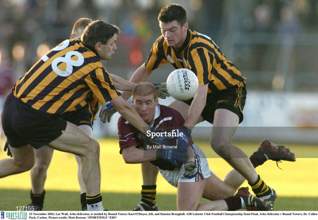 23 November 2003; Lar Wall, Arles-Kilcruise, is tackled by Round Towers Karl O'Dwyer, left, and Damien Broughall. AIB Leinster Club Football Championship Semi-Final, Arles-Kilcruise v Round Towers, Dr. Cullen Park, Carlow. Picture credit; Matt Browne / SPORTSFILE *EDI*