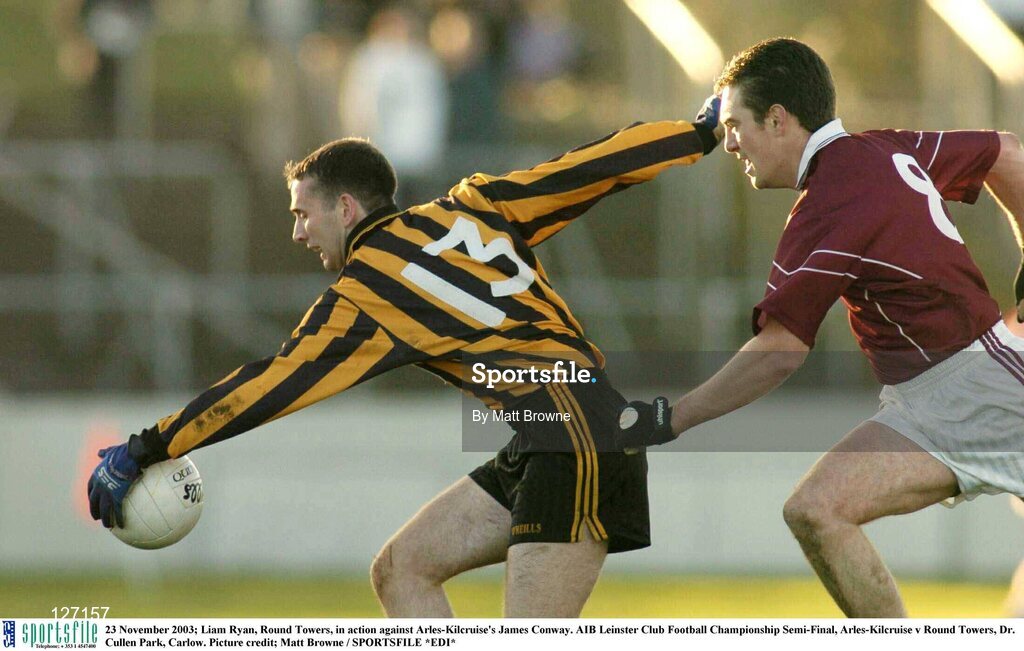 23 November 2003; Liam Ryan, Round Towers, in action against Arles-Kilcruise's James Conway. AIB Leinster Club Football Championship Semi-Final, Arles-Kilcruise v Round Towers, Dr. Cullen Park, Carlow. Picture credit; Matt Browne / SPORTSFILE *EDI*