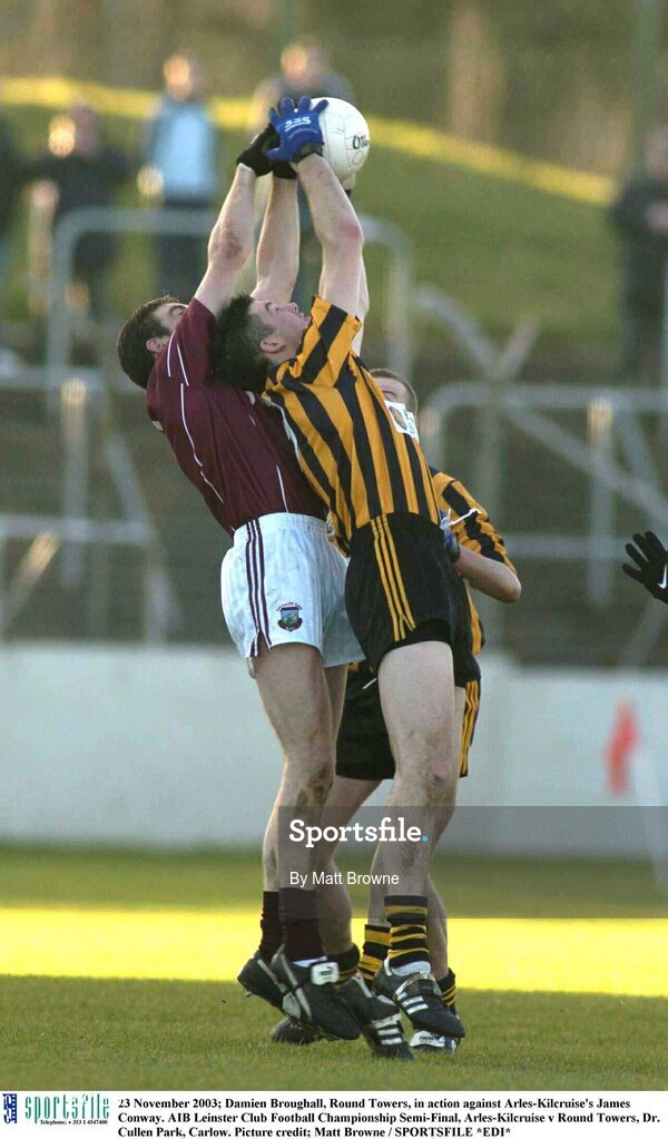 23 November 2003; Damien Broughall, Round Towers, in action against Arles-Kilcruise's James Conway. AIB Leinster Club Football Championship Semi-Final, Arles-Kilcruise v Round Towers, Dr. Cullen Park, Carlow. Picture credit; Matt Browne / SPORTSFILE *EDI*