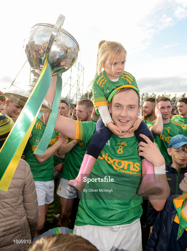 29 September 2019; Dunloy Captain Paul Shields and his daughter Ava Shields celebrate with the cup after the Antrim County Senior Club Hurling Final match between Cushendall Ruairí Óg and Dunloy at Ballycastle in Antrim. Photo by Oliver McVeigh/Sportsfile