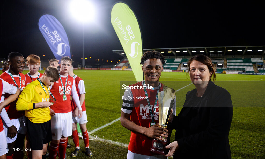 24 October 2019; Áine Plunkett, Lead marketing manager with SSE Airtricity, presents the trophy to Glory Nzingo of St Patricks Athletic following the SSE Airtricity Under-15 League Final match between Shamrock Rovers and St. Patrick's Athletic at Tallaght Stadium in Dublin. Photo by Eóin Noonan/Sportsfile