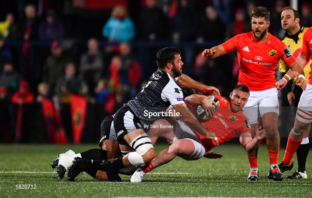 25 October 2019; Rory Scannell of Munster is tackled by Gareth Evans, left, and Tom Botha of Ospreys, hidden, during the Guinness PRO14 Round 4 match between Munster and Ospreys at Irish Independent Park in Cork. Photo by Sam Barnes/Sportsfile