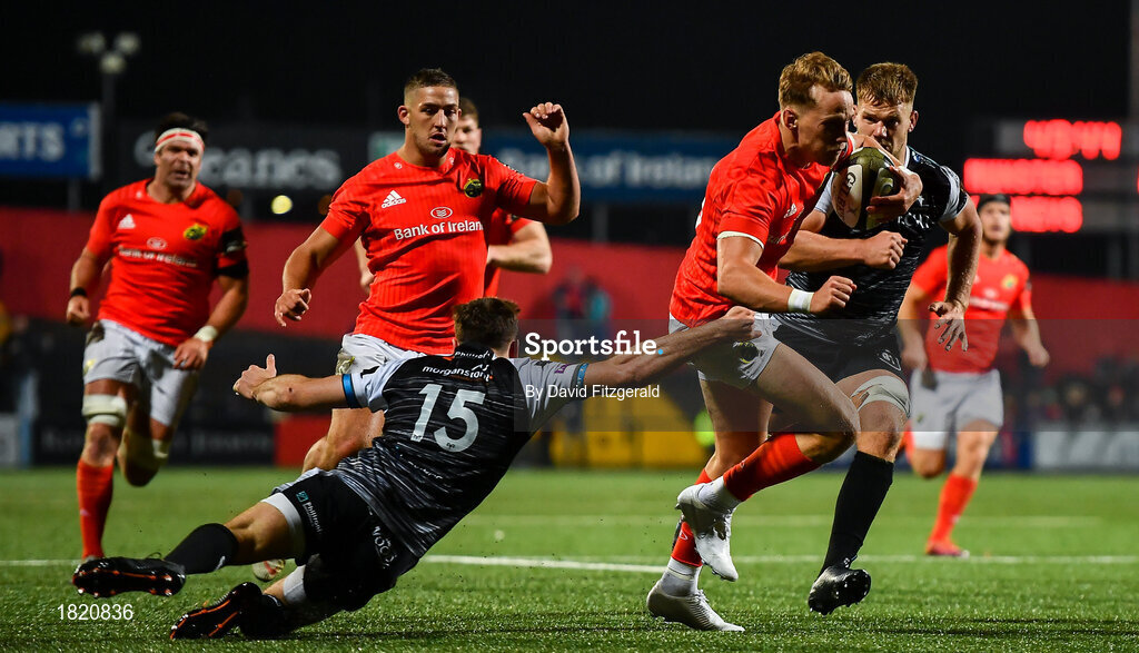 25 October 2019; Mike Haley of Munster slips the tackle from Cai Evans of Ospreys on his way to scoring his side's third try during the Guinness PRO14 Round 4 match between Munster and Ospreys at Irish Independent Park in Cork. Photo by David Fitzgerald/Sportsfile